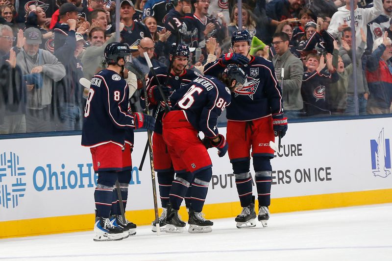 Oct 13, 2025; Columbus, Ohio, USA; Columbus Blue Jackets right wing Kirill Marchenko (86) celebrates his goal against the New Jersey Devils during the second period at Nationwide Arena. Mandatory Credit: Russell LaBounty-Imagn Images