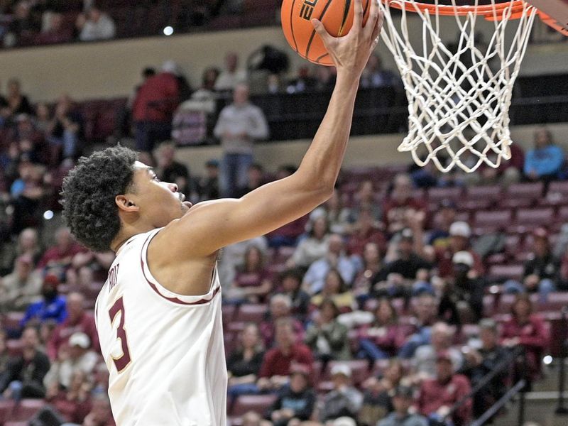 Jan 18, 2025; Tallahassee, Florida, USA; Florida State Seminoles guard Bostyn Holt (3) goes up for a layup against the Georgia Tech Yellowjackets during the second half at Donald L. Tucker Center. Mandatory Credit: Robert Myers-Imagn Images