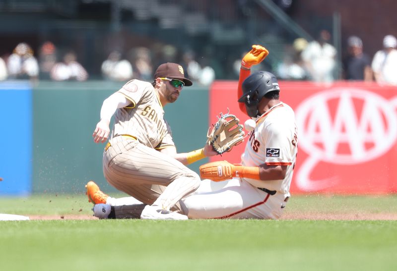 Jun 5, 2025; San Francisco, California, USA; San Francisco Giants left fielder Jerar Encarnacion (59) steals second base against San Diego Padres second baseman Tyler Wade (14) during the sixth inning at Oracle Park. Mandatory Credit: Kelley L Cox-Imagn Images