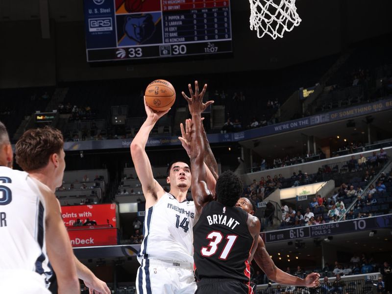 MEMPHIS, TN - OCTOBER 18: Zach Edey #14 of the Memphis Grizzlies shoots the ball during the game against the Miami Heat during a NBA pre season game on October 18, 2024 at FedExForum in Memphis, Tennessee. NOTE TO USER: User expressly acknowledges and agrees that, by downloading and or using this photograph, User is consenting to the terms and conditions of the Getty Images License Agreement. Mandatory Copyright Notice: Copyright 2024 NBAE (Photo by Joe Murphy/NBAE via Getty Images)