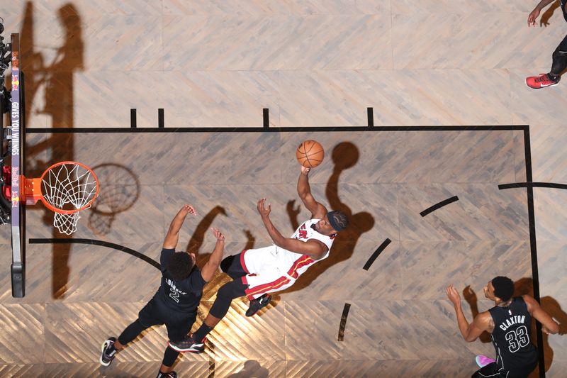 BROOKLYN, NY - JANUARY 15: Jimmy Butler #22 of the Miami Heat shoots the ball during the game against the Brooklyn Nets on January 15, 2024 at Barclays Center in Brooklyn, New York. NOTE TO USER: User expressly acknowledges and agrees that, by downloading and or using this Photograph, user is consenting to the terms and conditions of the Getty Images License Agreement. Mandatory Copyright Notice: Copyright 2024 NBAE (Photo by Nathaniel S. Butler/NBAE via Getty Images)