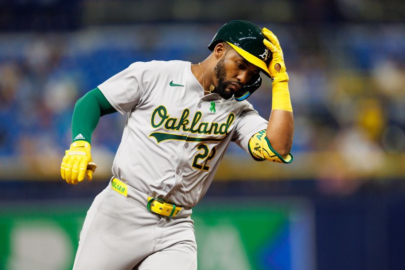 May 28, 2024; St. Petersburg, Florida, USA;  Oakland Athletics outfielder Miguel Andujar (22) runs the bases after hitting a three-run home run against the Tampa Bay Rays in the sixth inning  at Tropicana Field. Mandatory Credit: Nathan Ray Seebeck-USA TODAY Sports