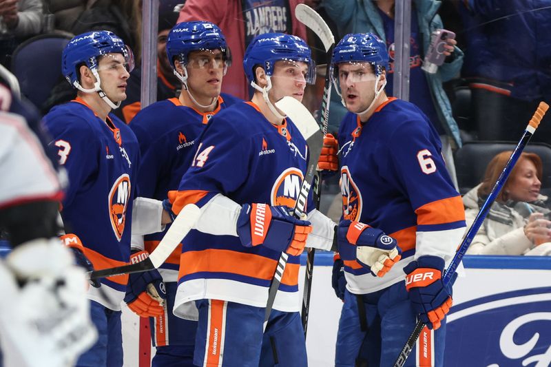 Jan 20, 2025; Elmont, New York, USA;  New York Islanders center Bo Horvat (14) celebrates with his teammates after scoring a goal in the second period against the Columbus Blue Jackets at UBS Arena. Mandatory Credit: Wendell Cruz-Imagn Images