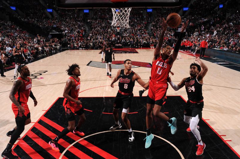 PORTLAND, OR - APRIL 12: Jock Landale #11 of the Houston Rockets goes up for the rebound during the game against the Portland Trail Blazers on April 12, 2024 at the Moda Center Arena in Portland, Oregon. NOTE TO USER: User expressly acknowledges and agrees that, by downloading and or using this photograph, user is consenting to the terms and conditions of the Getty Images License Agreement. Mandatory Copyright Notice: Copyright 2024 NBAE (Photo by Cameron Browne/NBAE via Getty Images)