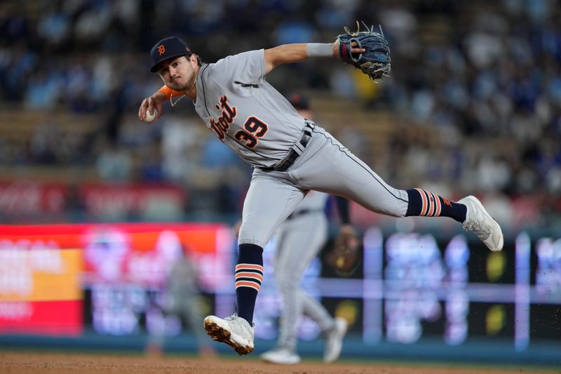 Sep 20, 2023; Los Angeles, California, USA; Detroit Tigers shortstop Zach McKinstry (39) throws to first base in the eighth inning against the Los Angeles Dodgers at Dodger Stadium. Mandatory Credit: Kirby Lee-USA TODAY Sports