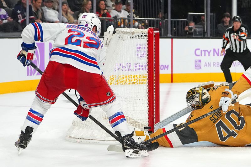 Nov 18, 2025; Las Vegas, Nevada, USA; New York Rangers center Jonny Brodzinski (22) hits the post over the glove of Vegas Golden Knights goaltender Akira Schmid (40) during the second period at T-Mobile Arena. Mandatory Credit: Stephen R. Sylvanie-Imagn Images