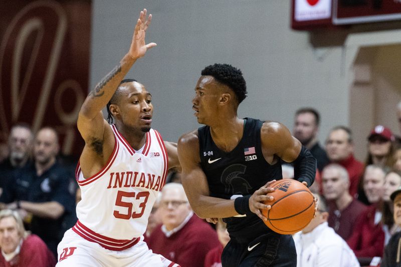 Jan 22, 2023; Bloomington, Indiana, USA; Michigan State Spartans guard Tyson Walker (2) looks to pass the ball while Indiana Hoosiers guard Tamar Bates (53) defends in the first half at Simon Skjodt Assembly Hall. Mandatory Credit: Trevor Ruszkowski-USA TODAY Sports