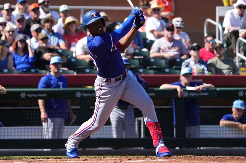 Mar 1, 2024; Scottsdale, Arizona, USA; Texas Rangers right fielder Elder Hernandez bats against the San Francisco Giants during the second inning at Scottsdale Stadium. Mandatory Credit: Joe Camporeale-USA TODAY Sports