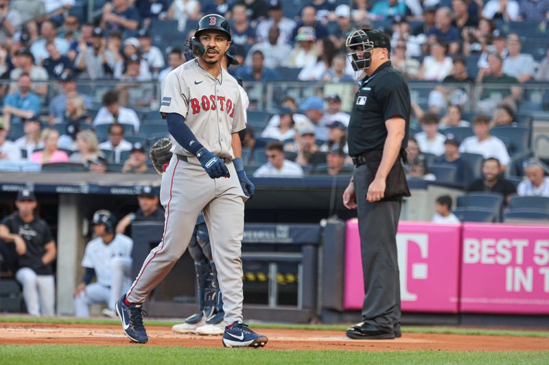 Jul 7, 2024; Bronx, New York, USA;  Boston Red Sox shortstop David Hamilton (70) reacts after being called out on strikes by umpire Lance Barrett (16) during the first inning against the New York Yankees at Yankee Stadium. Mandatory Credit: Vincent Carchietta-USA TODAY Sports