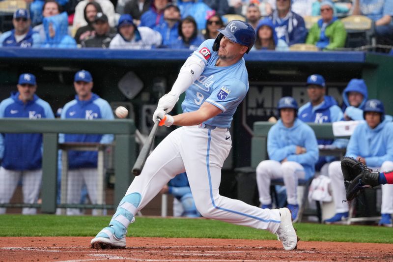 May 5, 2024; Kansas City, Missouri, USA; Kansas City Royals first baseman Vinnie Pasquantino (9) hits a one run sacrifice against the Texas Rangers in the first inning at Kauffman Stadium. Mandatory Credit: Denny Medley-USA TODAY Sports