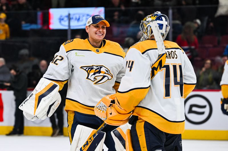 Dec 10, 2023; Montreal, Quebec, CAN; Nashville Predators goalie Kevin Lankinen (32) and goalie Juuse Saros (74) celebrate the win against the Montreal Canadiens after the third period at Bell Centre. Mandatory Credit: David Kirouac-USA TODAY Sports