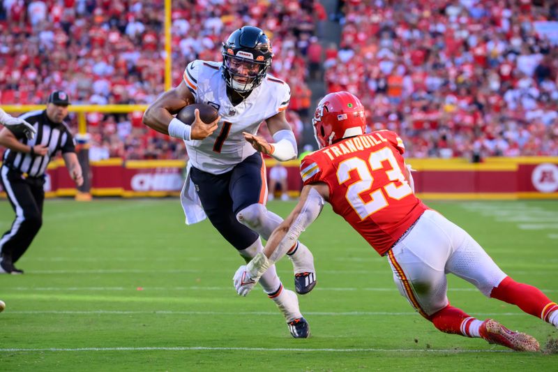 Chicago Bears quarterback Justin Fields (1) is tackled by Kansas City Chiefs linebacker Drue Tranquill (23) during the second half of an NFL football game, Sunday, Sept. 24, 2023 in Kansas City, Mo. (AP Photo/Reed Hoffmann)