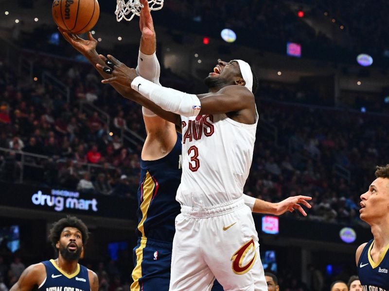 CLEVELAND, OHIO - DECEMBER 21: Caris LeVert #3 of the Cleveland Cavaliers shoots over Jonas Valanciunas #17 of the New Orleans Pelicans during the second quarter at Rocket Mortgage Fieldhouse on December 21, 2023 in Cleveland, Ohio. NOTE TO USER: User expressly acknowledges and agrees that, by downloading and or using this photograph, User is consenting to the terms and conditions of the Getty Images License Agreement. (Photo by Jason Miller/Getty Images)