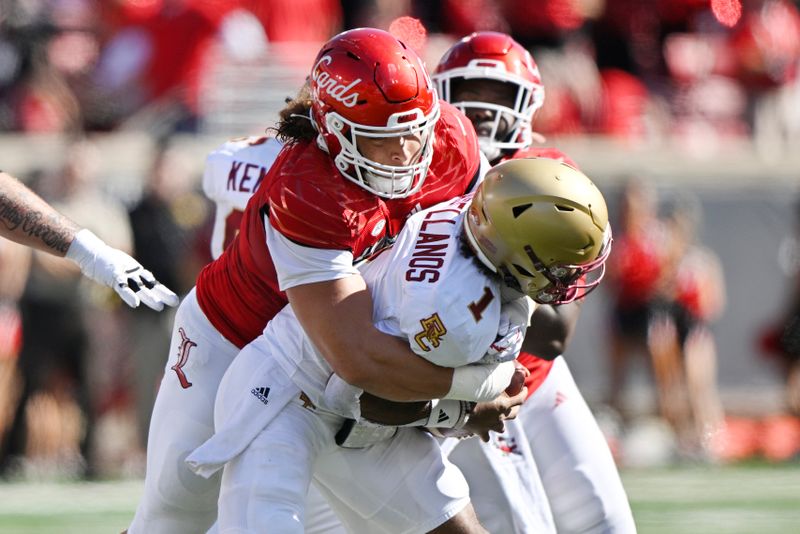 Sep 23, 2023; Louisville, Kentucky, USA; Louisville Cardinals defensive lineman Ashton Gillotte (9) sacks Boston College Eagles quarterback Thomas Castellanos (1) during the first half at L&N Federal Credit Union Stadium. Mandatory Credit: Jamie Rhodes-USA TODAY Sports