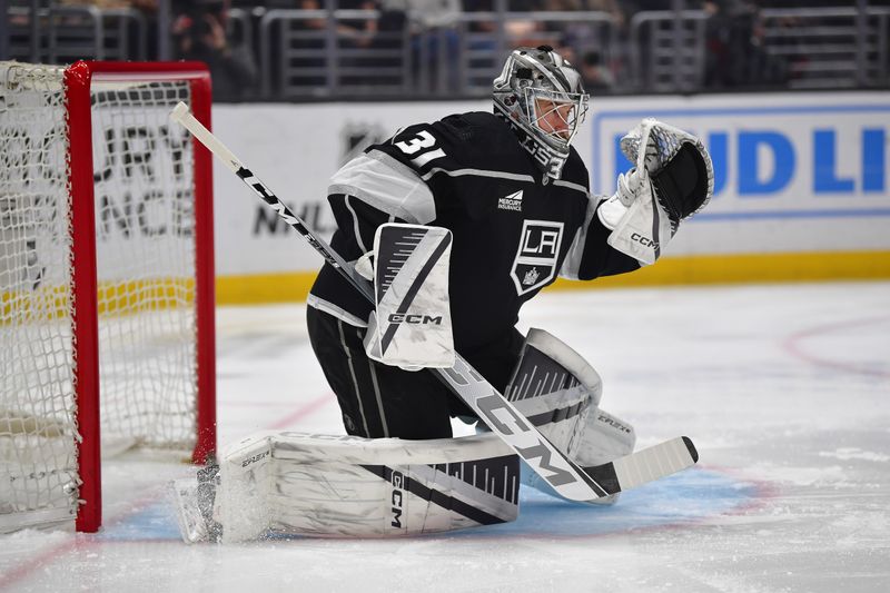 Mar 20, 2024; Los Angeles, California, USA; Los Angeles Kings goaltender David Rittich (31) defends the goal against the Minnesota Wild during the first period at Crypto.com Arena. Mandatory Credit: Gary A. Vasquez-USA TODAY Sports