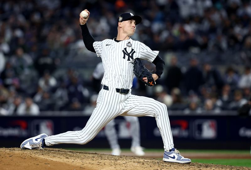 Oct 28, 2024; New York, New York, USA; New York Yankees pitcher Luke Weaver (30) throws during the ninth inning against the Los Angeles Dodgers in game three of the 2024 MLB World Series at Yankee Stadium. Mandatory Credit: Wendell Cruz-Imagn Images