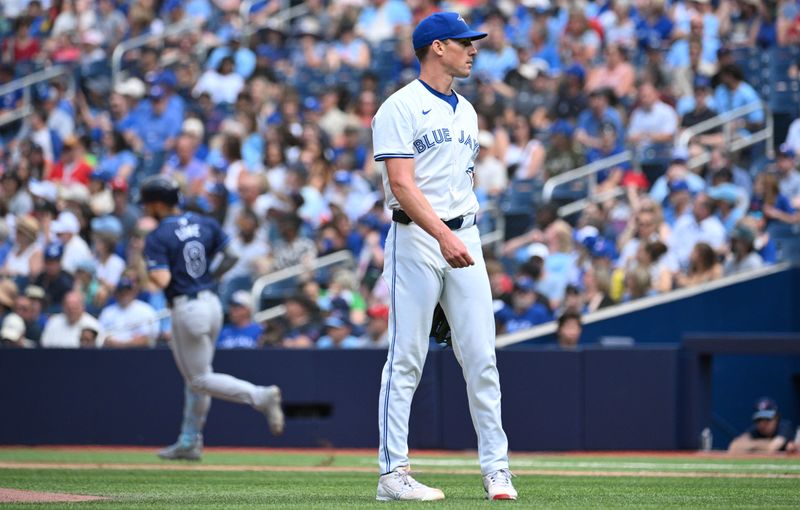 Jul 25, 2024; Toronto, Ontario, CAN; Toronto Blue Jays pitcher Chris Bassitt (40) waits for a new ball after giving up a solo home run to Tampa Bay Rays designated hitter Brandon Lowe (8) in the first inning at Rogers Centre. Mandatory Credit: Dan Hamilton-USA TODAY Sports