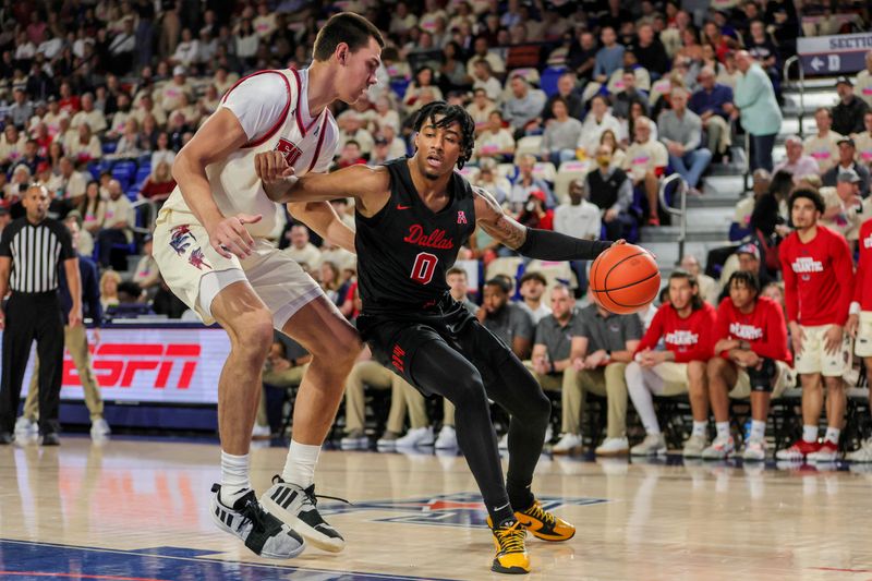 Feb 22, 2024; Boca Raton, Florida, USA; Southern Methodist Mustangs guard B.J. Edwards (0) drives to the basket against Florida Atlantic Owls center Vladislav Goldin (50) during the first half at Eleanor R. Baldwin Arena. Mandatory Credit: Sam Navarro-USA TODAY Sports