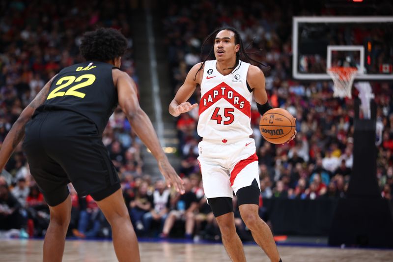 ALBERTA, CANADA - OCTOBER 2: Dalano Banton #45 of the Toronto Raptors dribbles the ball against the Utah Jazz during a preseason game on October 2, 2022 at the Rogers Place in Edmonton, Alberta, Canada.  NOTE TO USER: User expressly acknowledges and agrees that, by downloading and or using this Photograph, user is consenting to the terms and conditions of the Getty Images License Agreement.  Mandatory Copyright Notice: Copyright 2022 NBAE (Photo by Vaughn Ridley/NBAE via Getty Images)