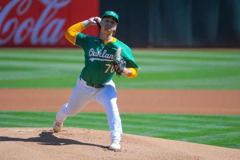 Sep 26, 2024; Oakland, California, USA; Oakland Athletics pitcher J.T. Ginn (70) throws a pitch against the Texas Rangers during the first inning at Oakland-Alameda County Coliseum. Mandatory Credit: Ed Szczepanski-Imagn Images