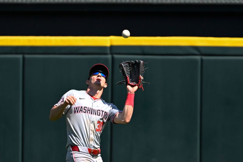 May 15, 2024; Chicago, Illinois, USA;  Washington Nationals outfielder Jacob Young (30) catches a fly ball hit by Chicago White Sox first baseman Andrew Vaughn (not shown) during the eighth inning at Guaranteed Rate Field. Mandatory Credit: Matt Marton-USA TODAY Sports