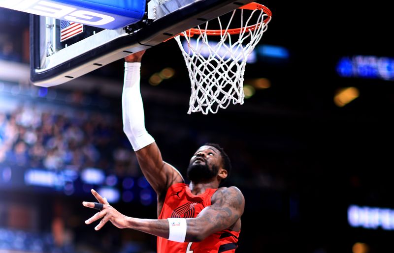 ORLANDO, FLORIDA - APRIL 01: Deandre Ayton #2 of the Portland Trail Blazers drives to the basket during a game against the Orlando Magic at Kia Center on April 01, 2024 in Orlando, Florida. NOTE TO USER: User expressly acknowledges and agrees that, by downloading and or using this photograph, User is consenting to the terms and conditions of the Getty Images License Agreement. (Photo by Mike Ehrmann/Getty Images)