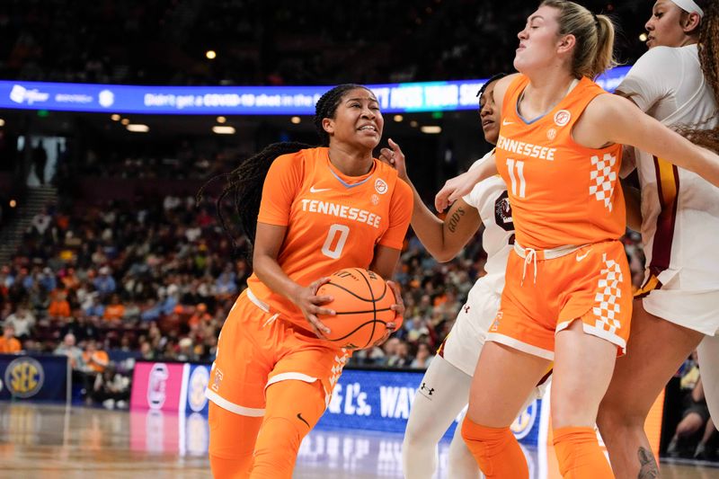 Mar 9, 2024; Greensville, SC, USA; Tennessee Lady Vols guard Jewel Spear (0) follows a block by forward Karoline Striplin (11) against the South Carolina Gamecocks during the first half at Bon Secours Wellness Arena. Mandatory Credit: Jim Dedmon-USA TODAY Sports