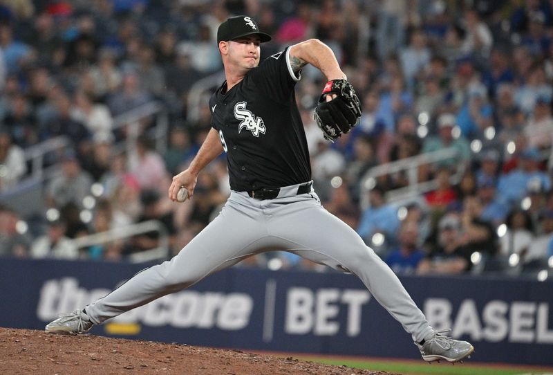 May 21, 2024; Toronto, Ontario, CAN;   Chicago White Sox relief pitcher Jordan Leasure (49) delivers a pitch against the Toronto Blue Jays in the eight inning at Rogers Centre. Mandatory Credit: Dan Hamilton-USA TODAY Sports