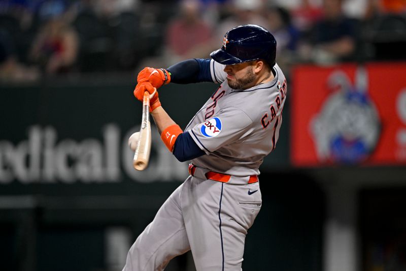 May 16, 2025; Arlington, Texas, USA; Houston Astros catcher Victor Caratini (17) bats against the Texas Rangers during the first inning at Globe Life Field. Mandatory Credit: Jerome Miron-Imagn Images