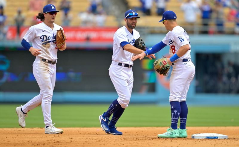 Aug 19, 2023; Los Angeles, California, USA;  Los Angeles Dodgers center fielder James Outman (33), left fielder Chris Taylor (3) and shortstop Enrique Hernandez (8) celebrate after the the ninth inning against the Miami Marlins at Dodger Stadium. Mandatory Credit: Jayne Kamin-Oncea-USA TODAY Sports