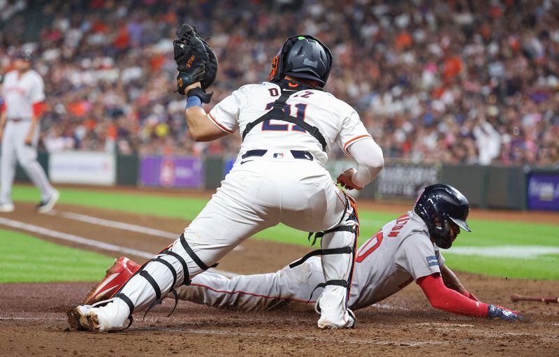 Aug 20, 2024; Houston, Texas, USA; Boston Red Sox second baseman David Hamilton (70) scores a run past Houston Astros catcher Yainer Diaz (21) during the fourth inning at Minute Maid Park. Mandatory Credit: Troy Taormina-USA TODAY Sports