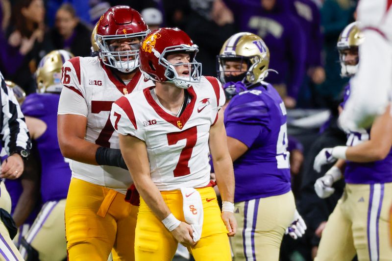 Nov 2, 2024; Seattle, Washington, USA; USC Trojans quarterback Miller Moss (7) reacts following a turnover on downs against the Washington Huskies during the fourth quarter at Alaska Airlines Field at Husky Stadium. Mandatory Credit: Joe Nicholson-Imagn Images