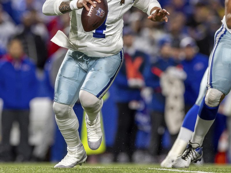 Dallas Cowboys quarterback Dak Prescott (4) runs the ball against the Buffalo Bills in an NFL football game, Sunday, Dec. 17, 2023, in Orchard Park, NY. Bills defeated the Cowboys 31-10.(AP Photo/Jeff Lewis)