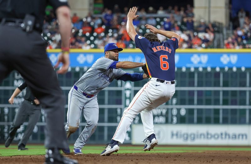 Apr 2, 2024; Houston, Texas, USA; Houston Astros center fielder Jake Meyers (6) is tagged out by Toronto Blue Jays third baseman Isiah Kiner-Falefa (7) on a play during the ninth inning at Minute Maid Park. Mandatory Credit: Troy Taormina-USA TODAY Sports