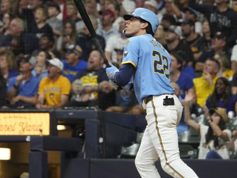 Sep 12, 2025; Milwaukee, Wisconsin, USA; Milwaukee Brewers outfielder Christian Yelich (22) hits a home run against the St. Louis Cardinals in the seventh inning at American Family Field. Mandatory Credit: Michael McLoone-Imagn Images