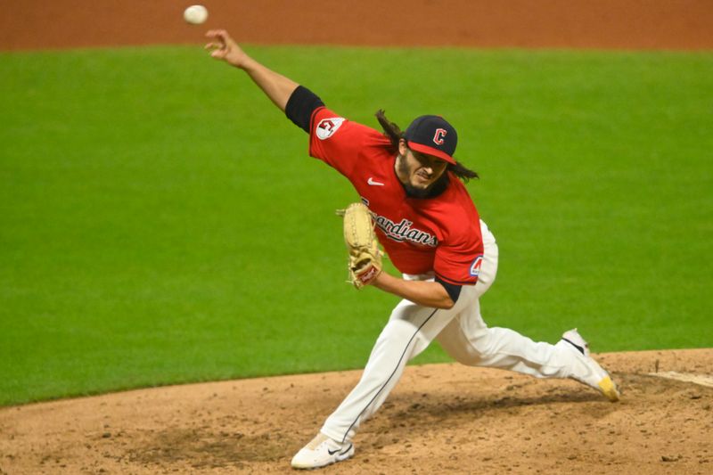 Sep 25, 2024; Cleveland, Ohio, USA; Cleveland Guardians relief pitcher Eli Morgan (49) delivers a pitch in the fifth inning against the Cincinnati Reds at Progressive Field. Mandatory Credit: David Richard-Imagn Images