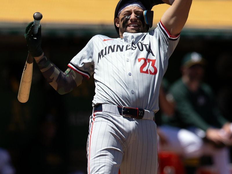 Jun 22, 2024; Oakland, California, USA; Minnesota Twins designated hitter Royce Lewis (23) ducks away from a high and tight pitch from Oakland Athletics pitcher Osvaldo Bido during the third inning at Oakland-Alameda County Coliseum. Mandatory Credit: D. Ross Cameron-USA TODAY Sports
