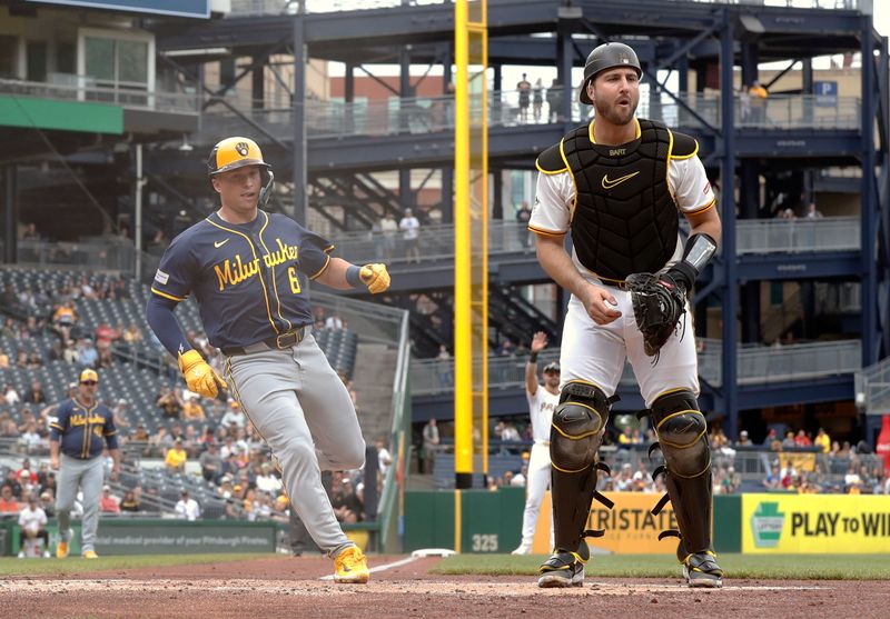 May 25, 2025; Pittsburgh, Pennsylvania, USA;  Milwaukee Brewers left fielder Isaac Collins (6) scores a run on a Pirates error as catcher Joey Bart (14) looks for the ball during the first inning at PNC Park. Mandatory Credit: Charles LeClaire-Imagn Images