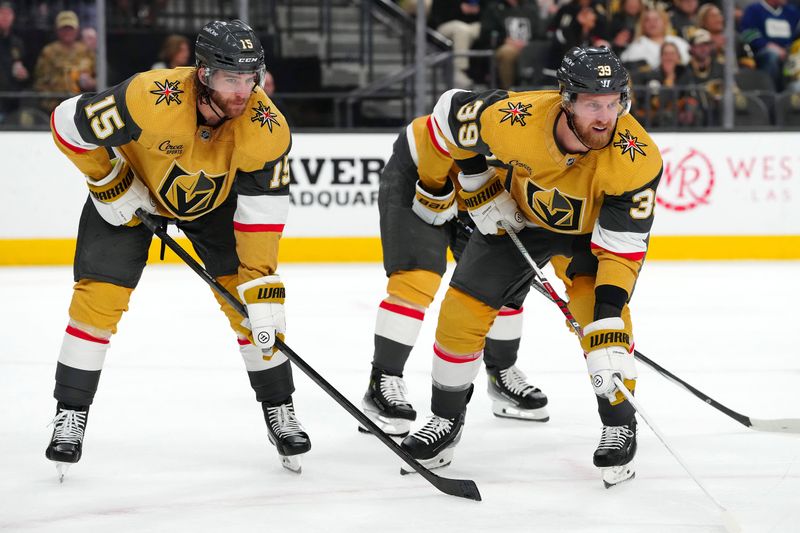 Mar 7, 2024; Las Vegas, Nevada, USA; Vegas Golden Knights defenseman Noah Hanifin (15) and Vegas Golden Knights right wing Anthony Mantha (39) await a face off against the Vancouver Canucks during the first period at T-Mobile Arena. Mandatory Credit: Stephen R. Sylvanie-USA TODAY Sports