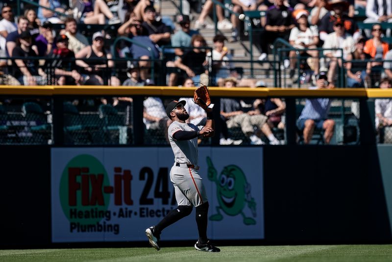 Sep 1, 2025; Denver, Colorado, USA; San Francisco Giants left fielder Heliot Ramos (17) makes a catch in the fourth inning against the Colorado Rockies at Coors Field. Mandatory Credit: Isaiah J. Downing-Imagn Images