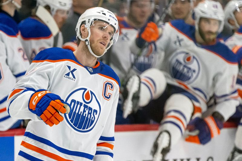 Jan 15, 2025; Saint Paul, Minnesota, USA;  Edmonton Oilers forward Connor McDavid (97) celebrates his power play goal against the Minnesota Wild during the first period at Xcel Energy Center. Mandatory Credit: Nick Wosika-Imagn Images

