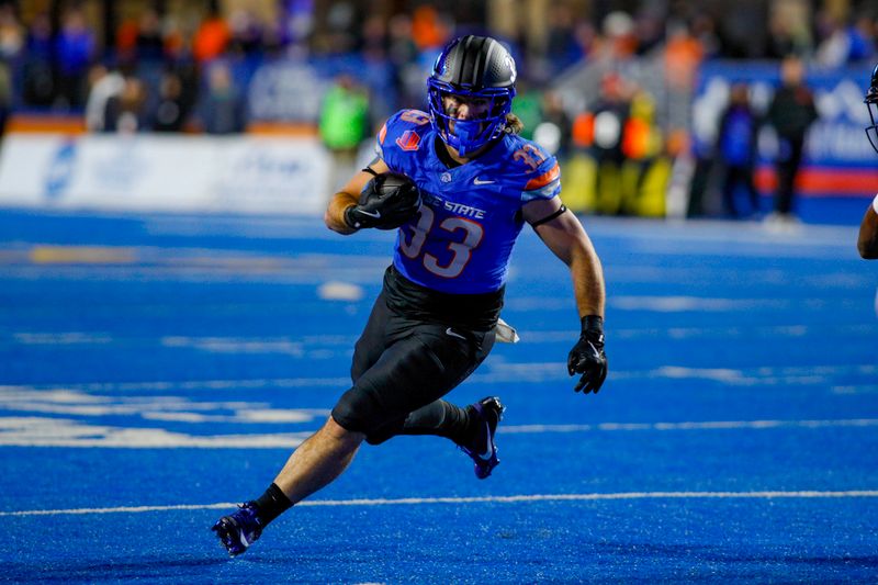 Nov 1, 2024; Boise, Idaho, USA; Boise State Broncos fullback Tyler Crowe (33) runs during the second half  against the San Diego State Aztecs at Albertsons Stadium. Mandatory Credit: Brian Losness-Imagn Images


