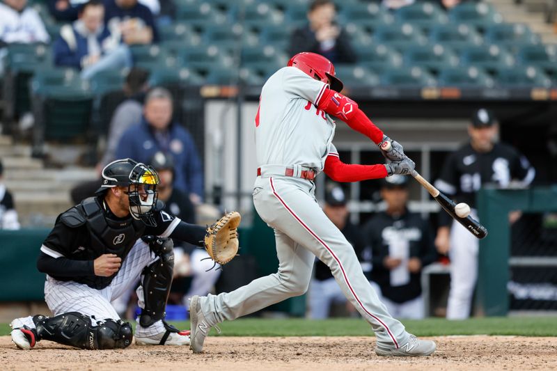 Apr 18, 2023; Chicago, Illinois, USA; Philadelphia Phillies left fielder Jake Cave (44) singles against the Chicago White Sox during the seventh inning of game one of the doubleheader at Guaranteed Rate Field. Mandatory Credit: Kamil Krzaczynski-USA TODAY Sports