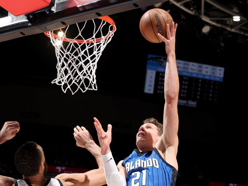 MINNEAPOLIS, MN -  FEBRUARY 3: Moritz Wagner #21 of the Orlando Magic drives to the basket against the Minnesota Timberwolves on February 3, 2023 at Target Center in Minneapolis, Minnesota. NOTE TO USER: User expressly acknowledges and agrees that, by downloading and or using this Photograph, user is consenting to the terms and conditions of the Getty Images License Agreement. Mandatory Copyright Notice: Copyright 2023 NBAE (Photo by David Sherman/NBAE via Getty Images)