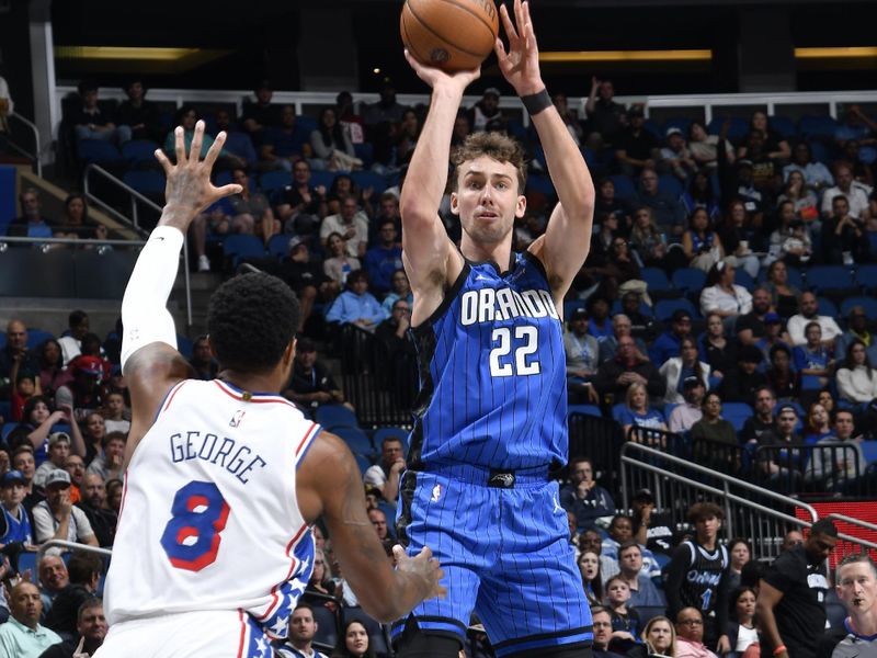 ORLANDO, FL - NOVEMBER 15: Franz Wagner #22 of the Orlando Magic shoots the ball during the game against the Philadelphia 76ers during the Emirates NBA Cup game on  November 15, 2024 at Kia Center in Orlando, Florida. NOTE TO USER: User expressly acknowledges and agrees that, by downloading and or using this photograph, User is consenting to the terms and conditions of the Getty Images License Agreement. Mandatory Copyright Notice: Copyright 2024 NBAE (Photo by Fernando Medina/NBAE via Getty Images)