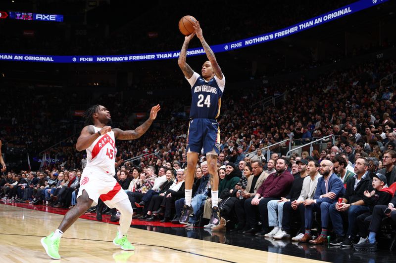 TORONTO, CANADA - JANUARY 27: Jordan Hawkins #24 of the New Orleans Pelicans shoots a three point basket during the game against the Toronto Raptors on January 27, 2025 at the Scotiabank Arena in Toronto, Ontario, Canada.  NOTE TO USER: User expressly acknowledges and agrees that, by downloading and or using this Photograph, user is consenting to the terms and conditions of the Getty Images License Agreement.  Mandatory Copyright Notice: Copyright 2025 NBAE (Photo by Vaughn Ridley/NBAE via Getty Images)