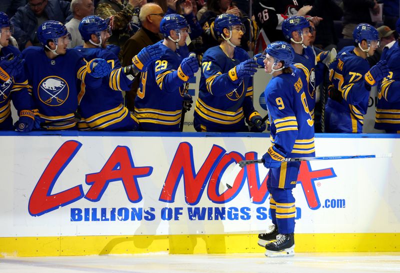 Nov 9, 2024; Buffalo, New York, USA;  Buffalo Sabres left wing Zach Benson (9) celebrates his goal with teammates during the first period against the Calgary Flames at KeyBank Center. Mandatory Credit: Timothy T. Ludwig-Imagn Images