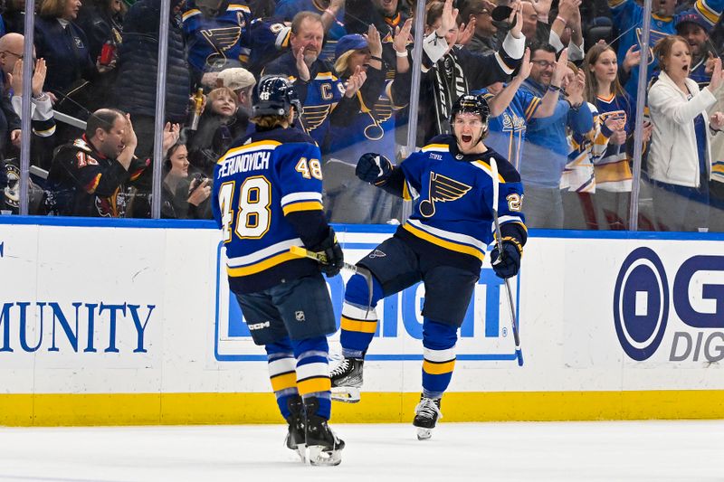 Mar 19, 2024; St. Louis, Missouri, USA;  St. Louis Blues left wing Nathan Walker (26) celebrates with defenseman Scott Perunovich (48) after scoring against the Colorado Avalanche during the first period at Enterprise Center. Mandatory Credit: Jeff Curry-USA TODAY Sports