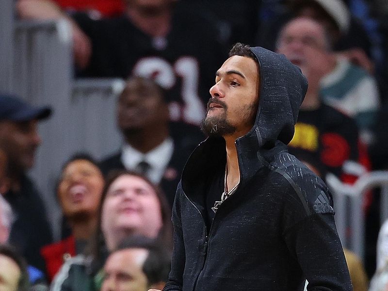 ATLANTA, GEORGIA - APRIL 09:  Trae Young #11 of the Atlanta Hawks holds onto the game ball during a timeout in the second quarter against the Miami Heat at State Farm Arena on April 09, 2024 in Atlanta, Georgia.  NOTE TO USER: User expressly acknowledges and agrees that, by downloading and/or using this photograph, user is consenting to the terms and conditions of the Getty Images License Agreement.  (Photo by Kevin C. Cox/Getty Images)