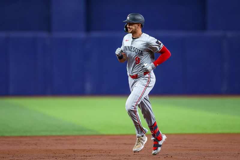 Sep 2, 2024; St. Petersburg, Florida, USA; -Minnesota Twins outfielder Trevor Larnach (9) runs the bases after hitting a three-run home run against the Tampa Bay Rays in the second inning at Tropicana Field. Mandatory Credit: Nathan Ray Seebeck-USA TODAY Sports